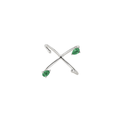 White gold ring with pear-cut emeralds on a white background