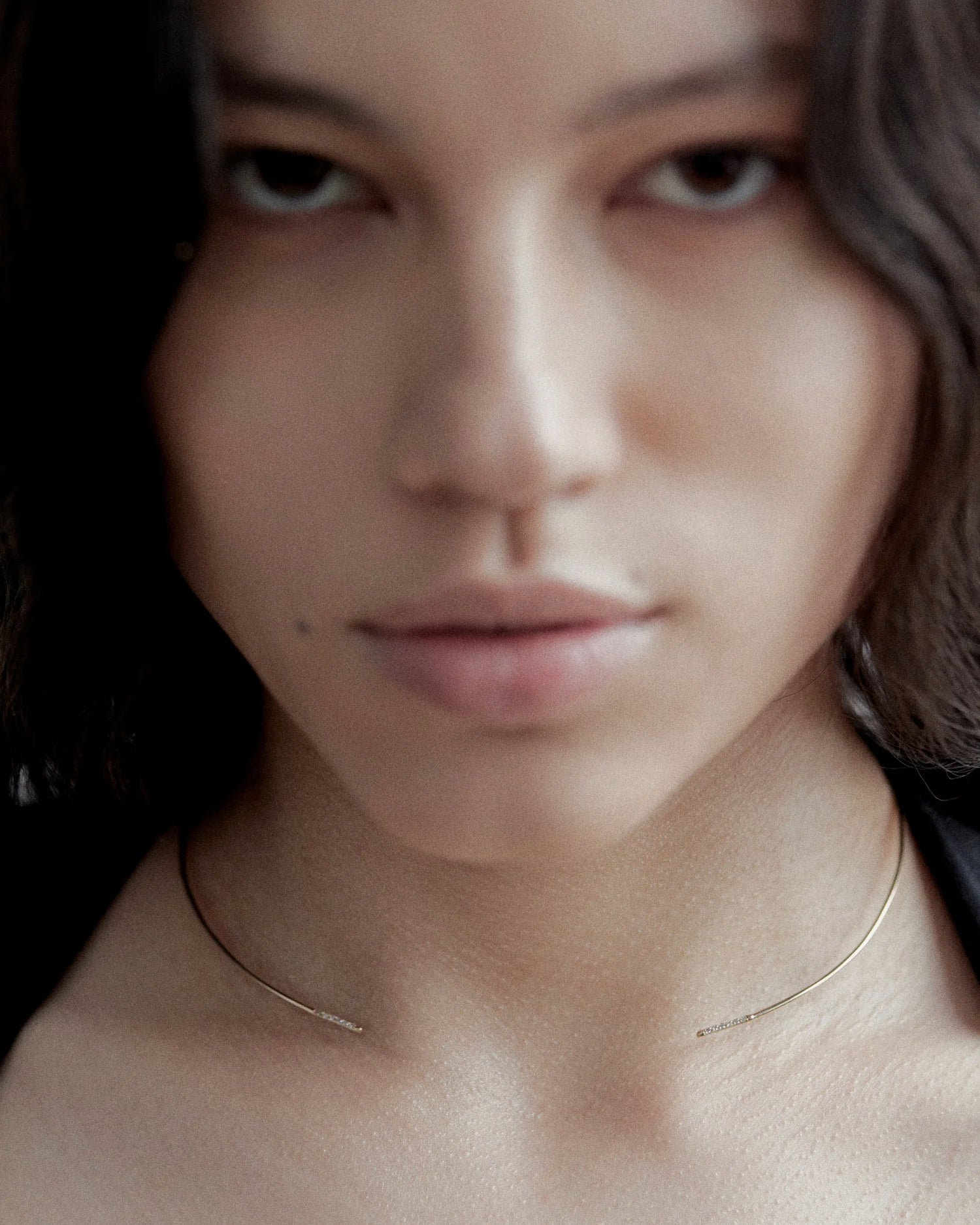 Color editorial of model with brown waves wearing Lera Treyger Earth 14k gold pavé-diamond choker collar