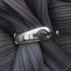 Lera Treyger LT x O.RIM sterling silver cuff bracelet with natural agate stone, close-up on pleated fabric