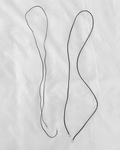 Lera Treyger LT x O.RIM thin leather cord necklace flat lay, both pieces shown with silver tip details