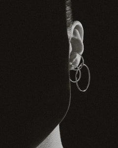 B&W ear macro of Lera Treyger Wind interlocked diamond and plain hoop ear cuff, dramatic side light